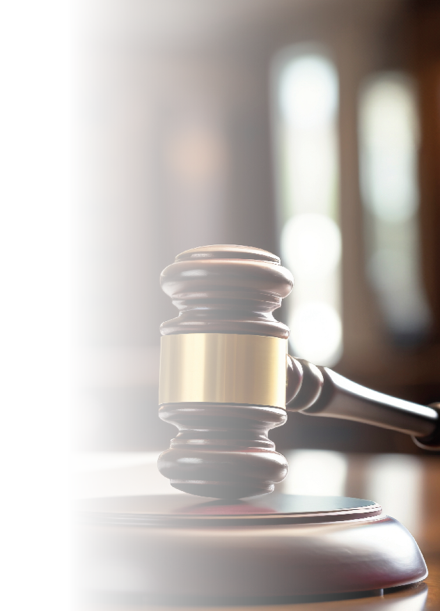 A wooden desk with a gavel and a book. AI generated content