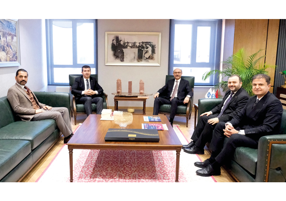 A group of men in suits sitting around a table. Description generated by AI