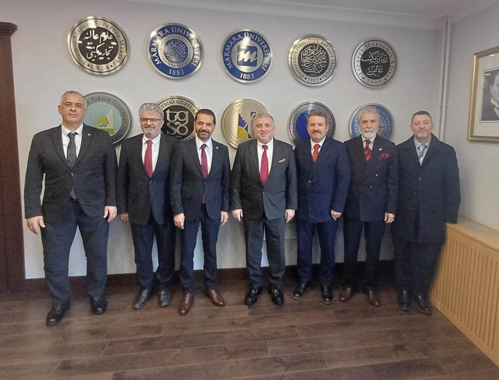 A group of men wearing suits and ties. Description generated by AI
