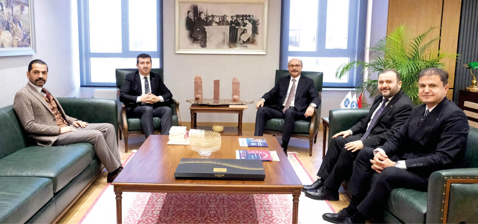 A group of men in suits sitting around a table. Description generated by AI