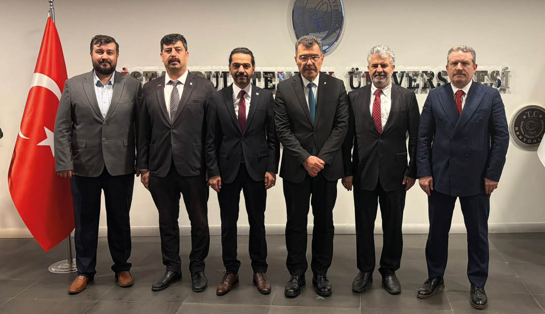 A group of men wearing suits and ties. Description generated by AI