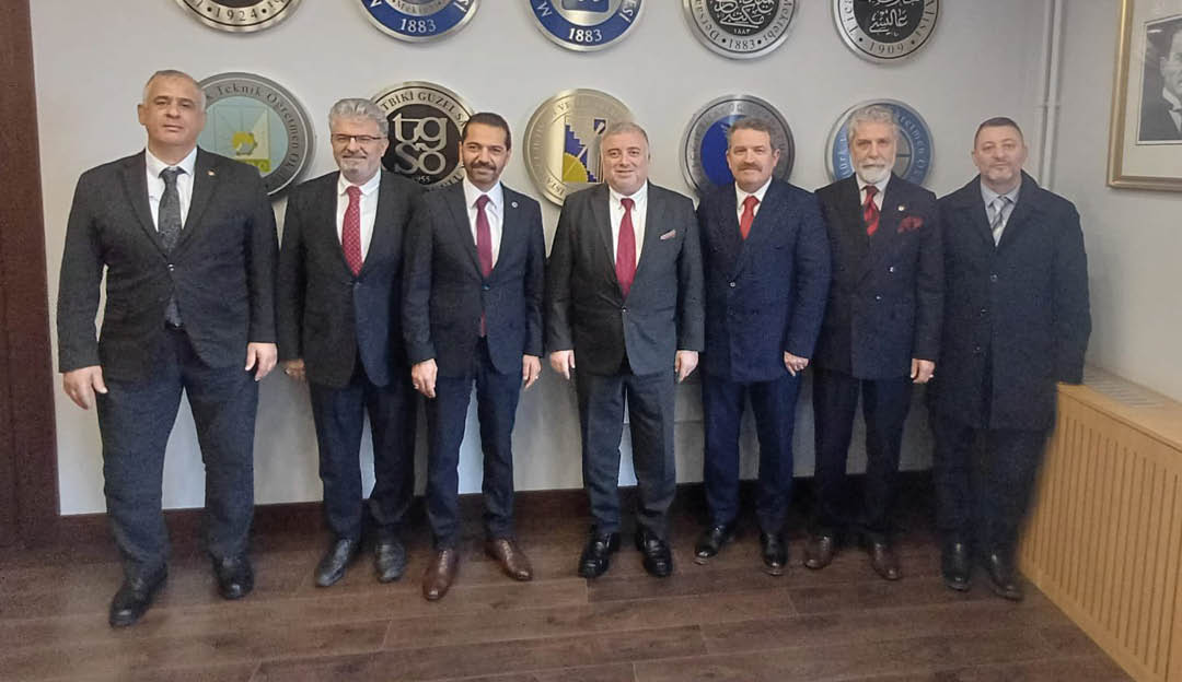 A group of men wearing suits and ties. Description generated by AI